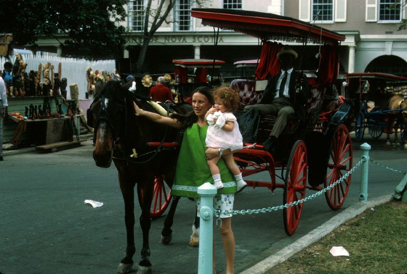   in front of  horse-drawn carriage  in Bahamas